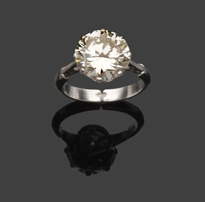 Lot 524 - A Diamond Solitaire Ring, the round brilliant cut diamond in a white eight claw setting, to a plain