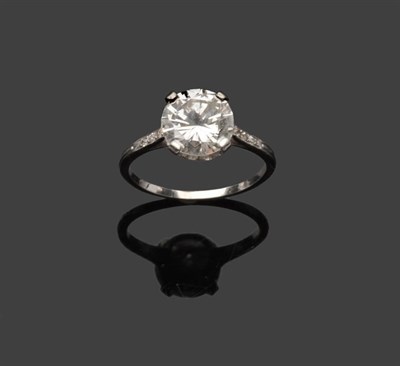 Lot 528 - A Diamond Solitaire Ring, the round brilliant cut diamond in a four claw setting, with diamond...