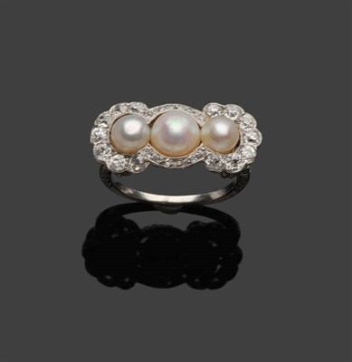 Lot 529 - A Cultured Pearl and Diamond Triple Cluster Ring, three graduated cultured pearls within a...