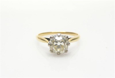 Lot 536 - A Diamond Solitaire Ring, the old cut diamond in a white claw setting to a yellow tapered...