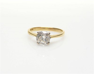 Lot 538 - An 18 Carat Gold Diamond Solitaire Ring, a round brilliant cut diamond in a four claw white setting