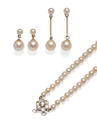 Lot 541 - A Cultured Pearl Necklace, seventy-eight slightly graduated pearls strung to a diamond cluster...