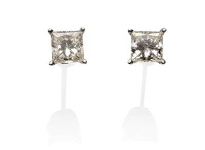 Lot 544 - A Pair of Princess Cut Diamond Solitaire Stud Earrings, total estimated diamond weight 2.50...