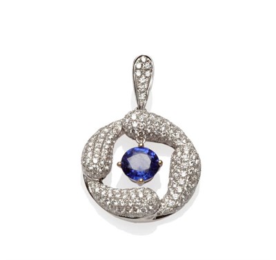 Lot 546 - An 18 Carat White Gold Sapphire and Diamond Pendant, a mixed cut sapphire suspends within a...