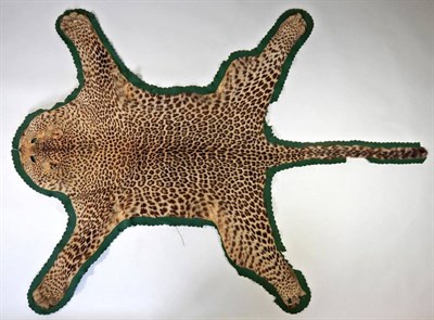 Lot 2183 - Taxidermy: African Leopard (Panthera pardus), circa 1920, flat skin rug with limbs...