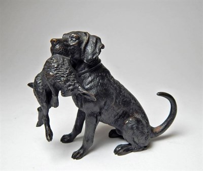 Lot 2327 - Sporting: A Bronze Model of a Gun Dog, with a retrieved hare within its mouth, 9cm high