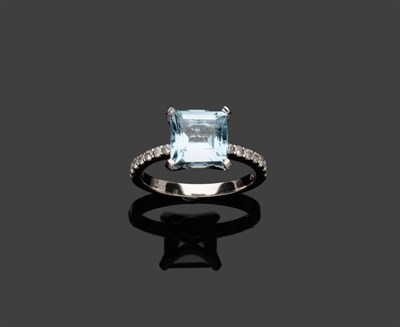 Lot 568 - An 18 Carat White Gold Aquamarine and Diamond Ring, the square step cut aquamarine in a white...