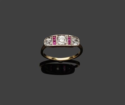 Lot 569 - An Early 20th Century Diamond and Ruby Ring, three graduated old cut diamonds spaced by two columns