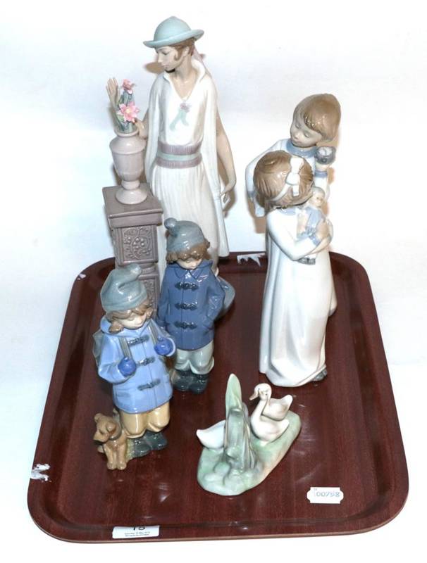 Lot 15 - Two Nao figures of children in nightgowns; a Lladro figure of a lady in 1920's dress; a Nao...
