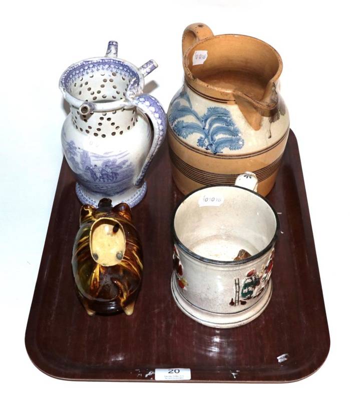 Lot 20 - A group of 19th century ceramics comprising of a puzzle jug; a frog mug; a pig form salt; and...