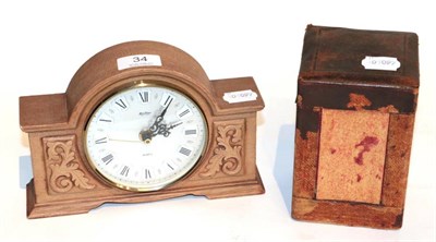 Lot 34 - A carriage timepiece; and a carved oak mantel timepiece with battery movement