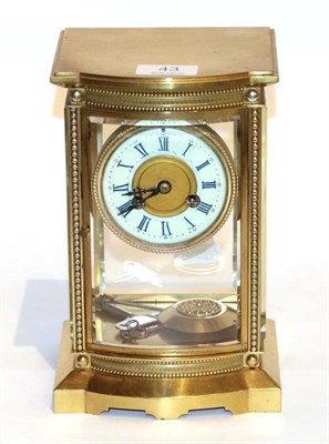 Lot 43 - A brass four glass striking mantel clock, circa 1900, twin barrel movement striking on a bell