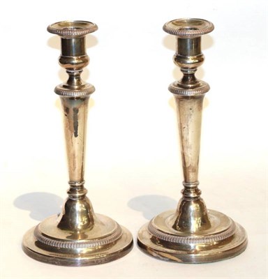 Lot 45 - A pair of George III silver candlesticks, Nathaniel Smith & Co, Sheffield 1809, plain tapering with