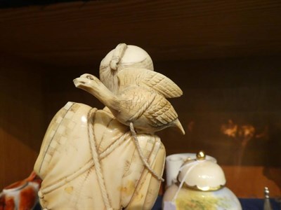 Lot 50 - A large Japanese carved ivory okimono