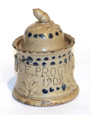 Lot 53 - An English pottery tobacco jar and cover, with acorn and oak leaf decoration ''W E Proctor 1902''