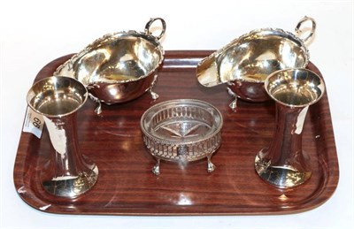 Lot 66 - A pair of silver sauce boats, Birmingham 1938; a pair of vases, Sheffield 1911; and a George...