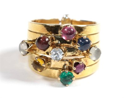 Lot 84 - A multi-gemstone stacking ring, of five bands each set with a cabochon, including emerald, citrine
