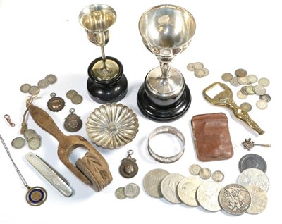 Lot 90 - A silver trophy cup; a quantity of coins; a silver pin dish; silver medals; silver napkin ring;...
