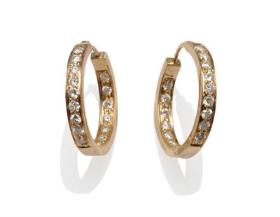 Lot 581 - A Pair of 9 Carat Gold Diamond Hoop Earrings, round brilliant cut diamonds set to the front and the