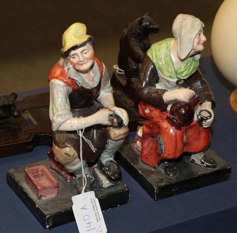 Lot 140 - A pair of pearlware figures of The Cobbler and his Wife