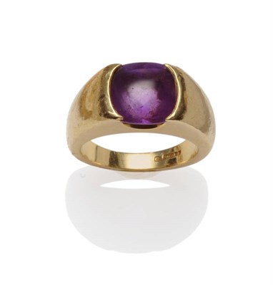 Lot 582 - An 18 Carat Gold Amethyst Ring, by Theo Fennell, a cabochon amethyst within a chunky gold ring...