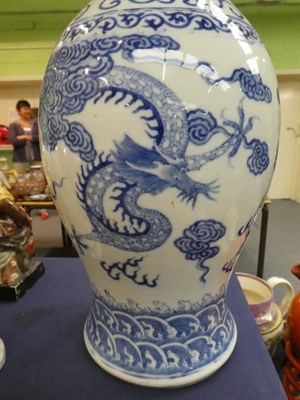 Lot 143 - A large Chinese blue and white porcelain vase, decorated with dragons chasing a flaming pearl...