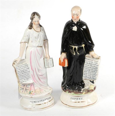 Lot 144 - A pair of Staffordshire pottery figures titled Popery and Protestantism