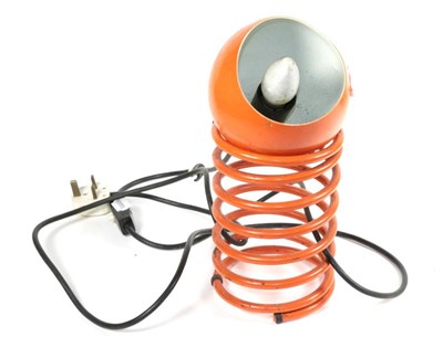 Lot 145 - A 1960's orange spring lamp