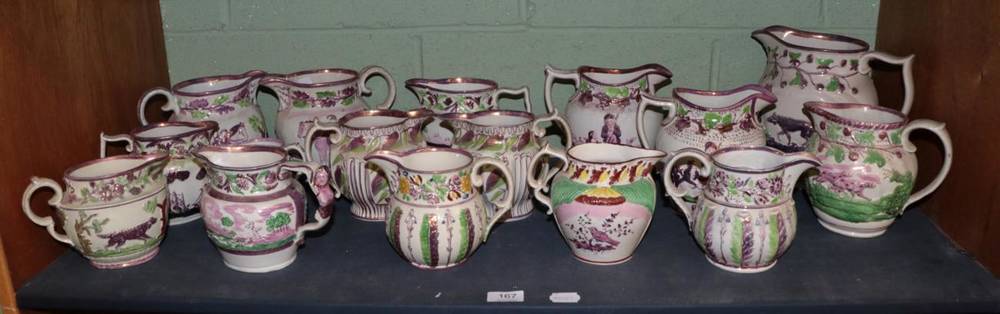 Lot 167 - A large group of pink lustre relief moulded jugs, many with hunting scenes