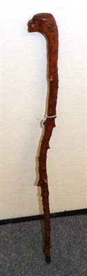 Lot 172 - An unusual carved walking stick in the form of heads bearing date 1851