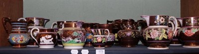 Lot 173 - A large group of pearlware and other copper lustre jugs, various designs, some relief moulded