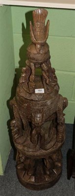 Lot 181 - A large carved wood tribal bowl on stand with figural supports