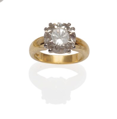 Lot 586 - An 18 Carat Gold Diamond Solitaire Ring, a round brilliant cut diamond in four white double...