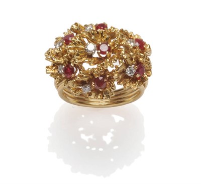 Lot 587 - An 18 Carat Gold Ruby and Diamond Ring, of abstract form, with round brilliant cut diamonds and...