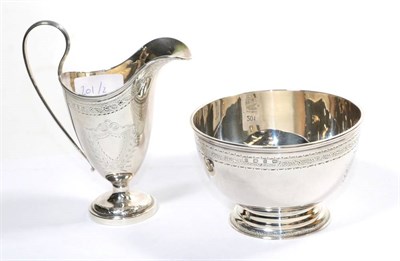 Lot 201 - A Victorian silver cream jug and sugar bowl, Samuel Walton Smith, Birmingham 1894/95, with engraved