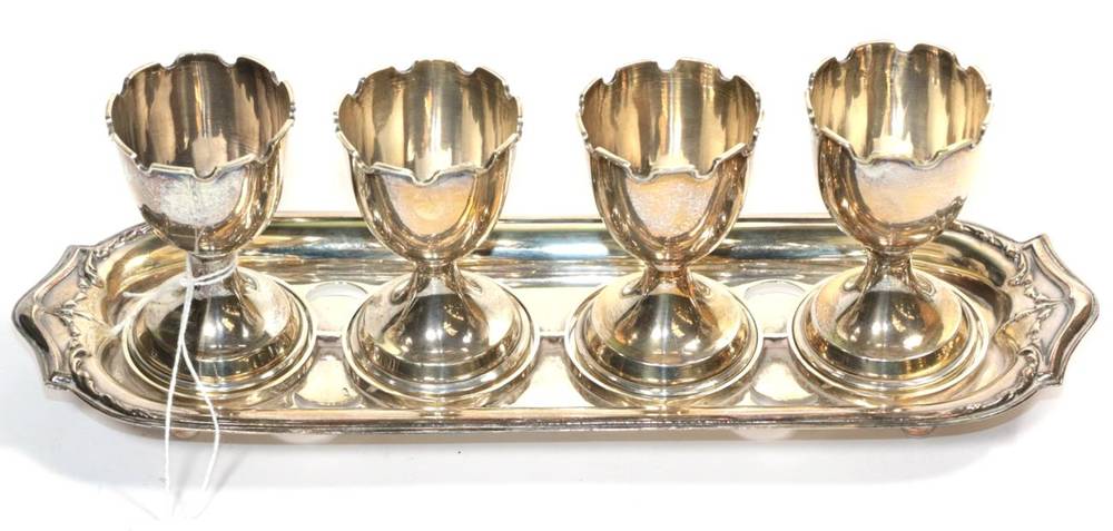 Lot 203 - A silver egg stand, Charles Usher, Birmingham 1930, with four detachable egg cups (weighted bases)