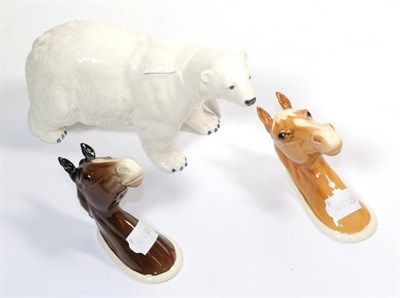 Lot 211 - A Beswick pottery polar bear and two Beswick horse head wall mounts