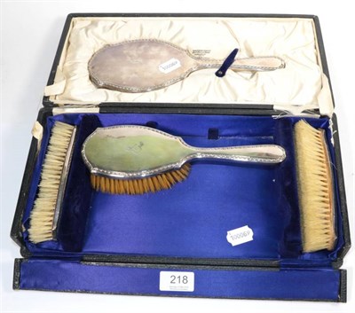 Lot 218 - A cased four piece silver brush and mirror set, Birmingham, 1922, retailed by Ogden's of Harrogate