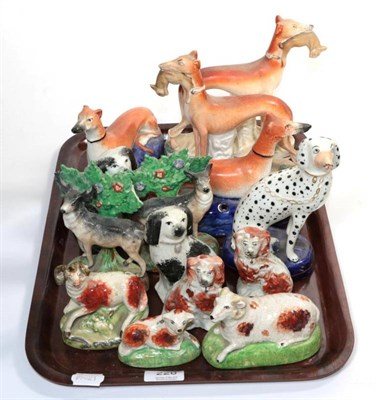 Lot 228 - A group of Staffordshire pottery models of animals, including greyhounds; deer; dogs etc