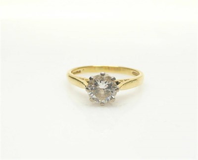 Lot 591 - An 18 Carat Gold Diamond Solitaire Ring, a round brilliant cut diamond held in a white eight...