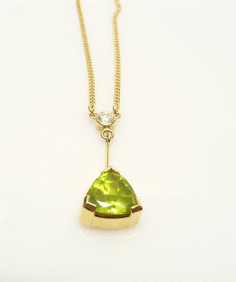 Lot 592 - An 18 Carat Gold Peridot and Diamond Necklace, a rubbed over set diamond suspends a knife edge...