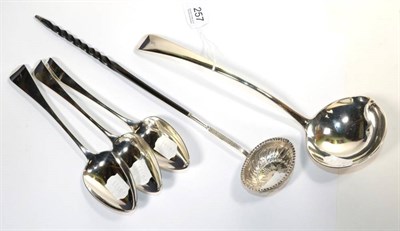 Lot 257 - A silver Old English pattern soup ladle, Manoah Rhodes, London 1929; a pair of George III...