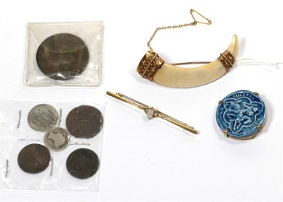 Lot 258 - An opal bar brooch, length 6.3cm; a wild boar tusk brooch, mounted in 15 carat gold; a pottery seal