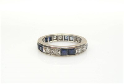 Lot 594 - A Sapphire and Diamond Full Eternity Ring, in a series of pairs of eight-cut diamonds and pairs...