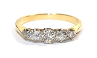 Lot 263 - A five stone diamond ring, the old cut diamonds in white claw settings, to yellow knife edge...