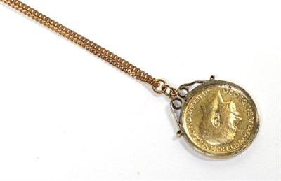 Lot 272 - A 1911 gold sovereign loose mounted as a pendant, on a 9 carat gold chain, chain length 56cm