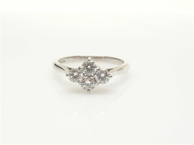 Lot 595 - An 18 Carat White Gold Diamond Cluster Ring, four round brilliant cut diamonds in claw settings...