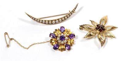 Lot 276 - An amethyst and cultured pearl brooch, stamped '9' '.375'; a garnet brooch, stamped '9' '.375'; and