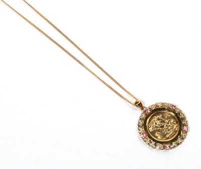 Lot 289 - A 2004 half sovereign loose mounted as a pendant in a gemstone set frame, on a chain stamped '375'