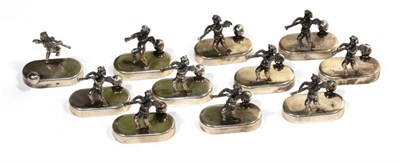 Lot 298 - A set of twelve white metal figural name card holders, marked 925 (one damaged)